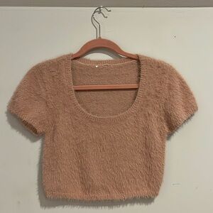 Pink short sleeve fuzzy top.
